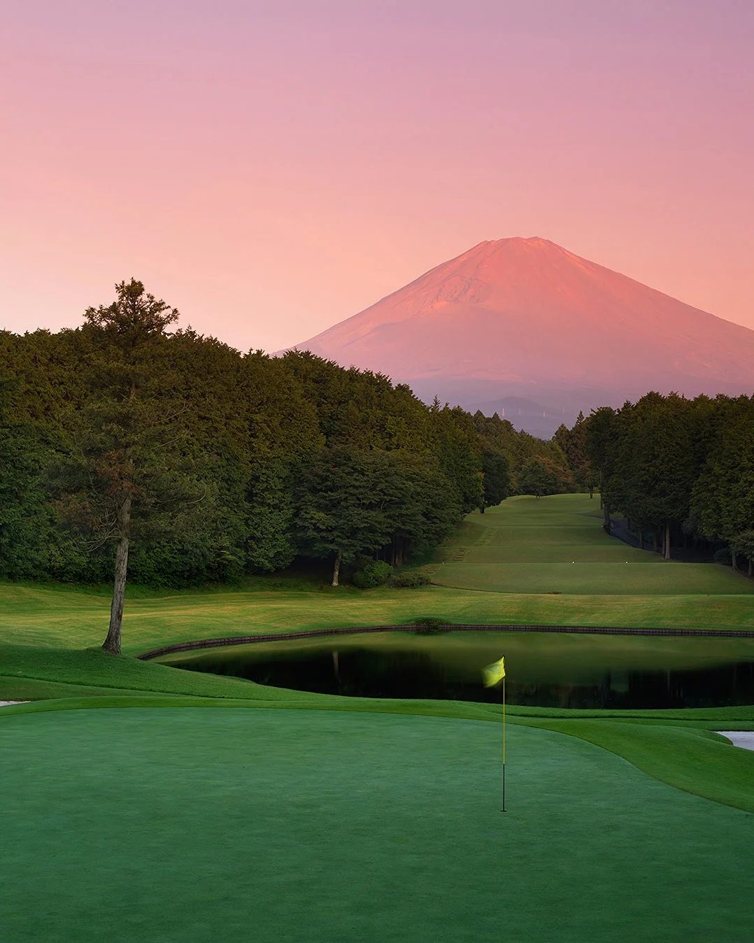 Mt Fuji at sunset over a golf course in Japan